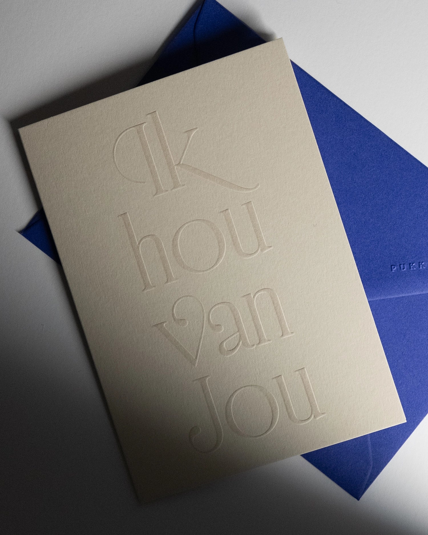 minimal luxury love card “ik hou van jou” with shadows on Colorplan Mist paper