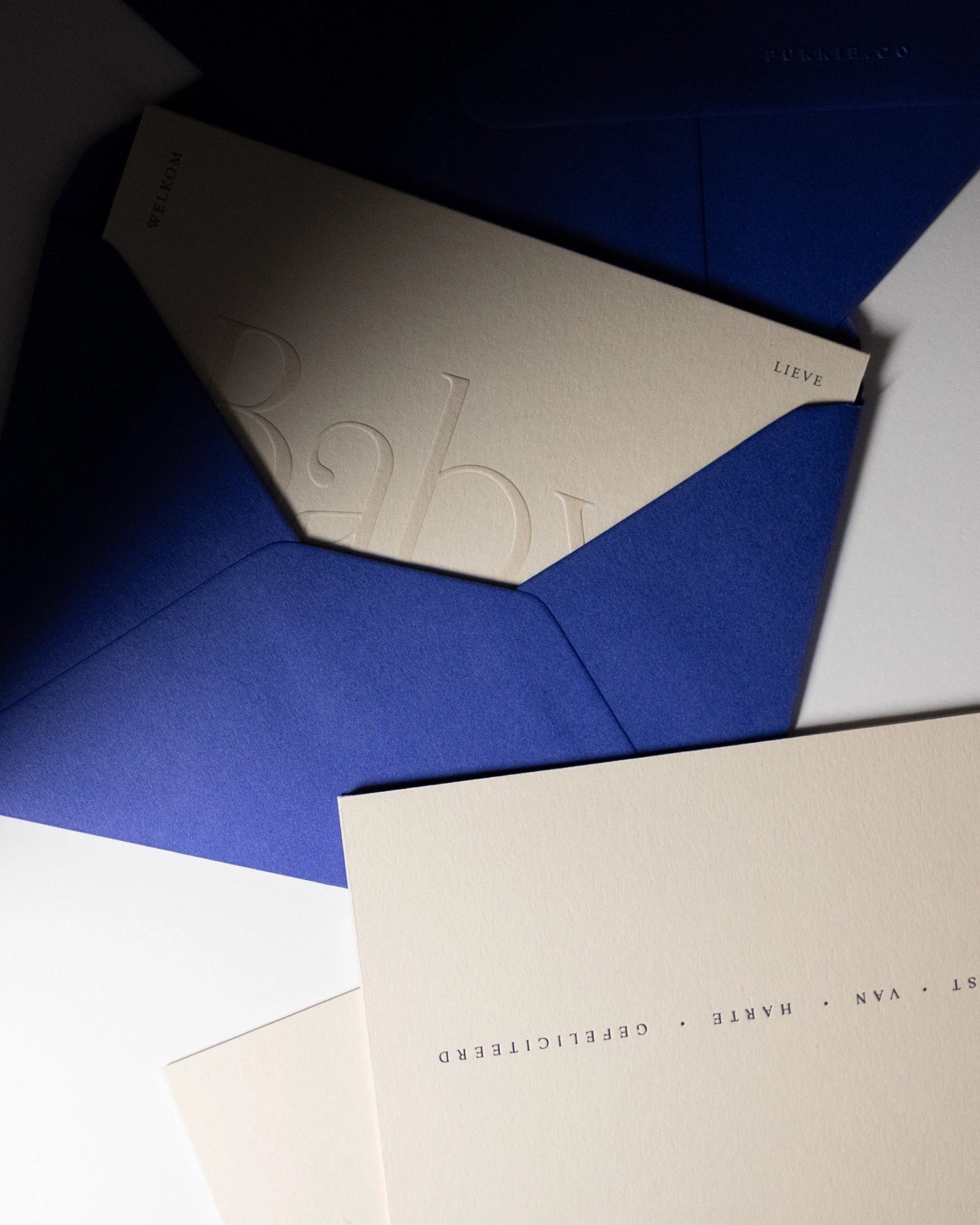 Minimal Collection of luxury embossed and letterpress greeting cards on Colorplan Mist paper with royal blue envelopes